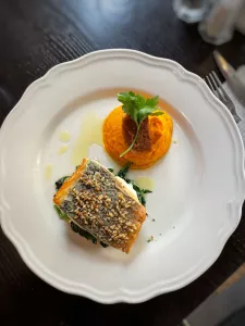 Filetto di Branzino, granella di nocciolla e tartufo estivo